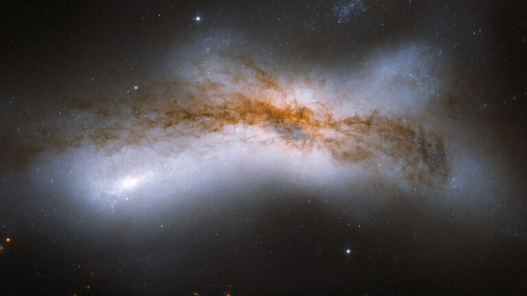 A bright cloud of cosmic material stretches across a dark void
